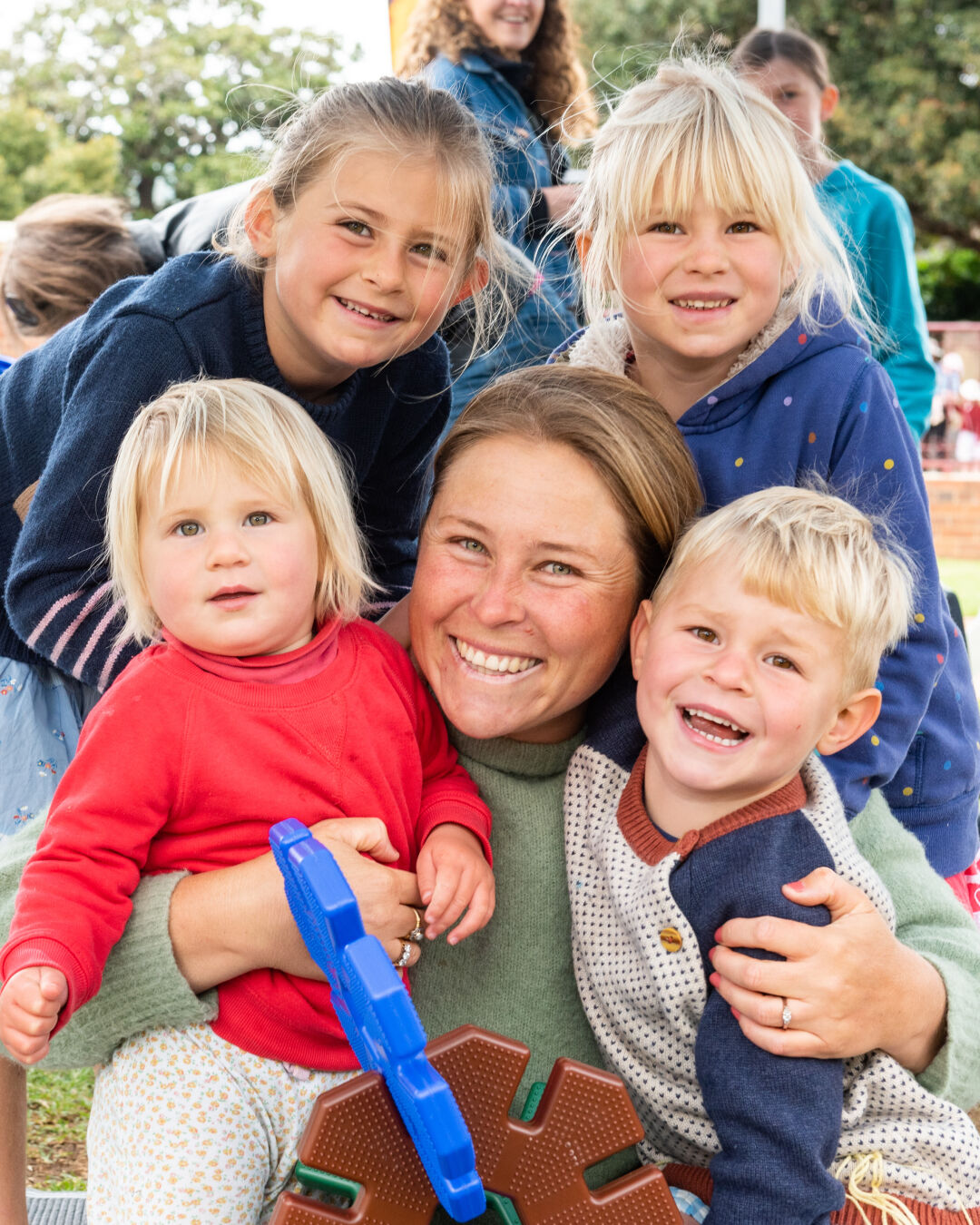 Smiling mum with four children