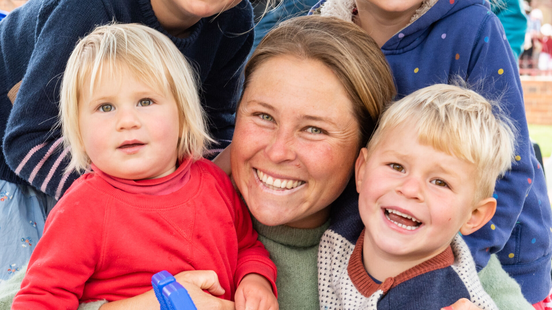 Smiling mum with four children